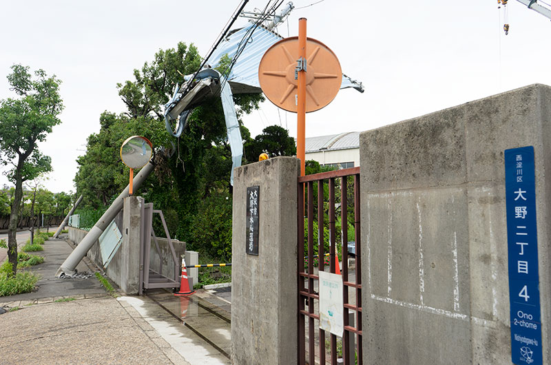 Two electric poles leaning due to typhoon 21