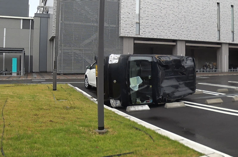 Cars blown at the parking due to typhoon