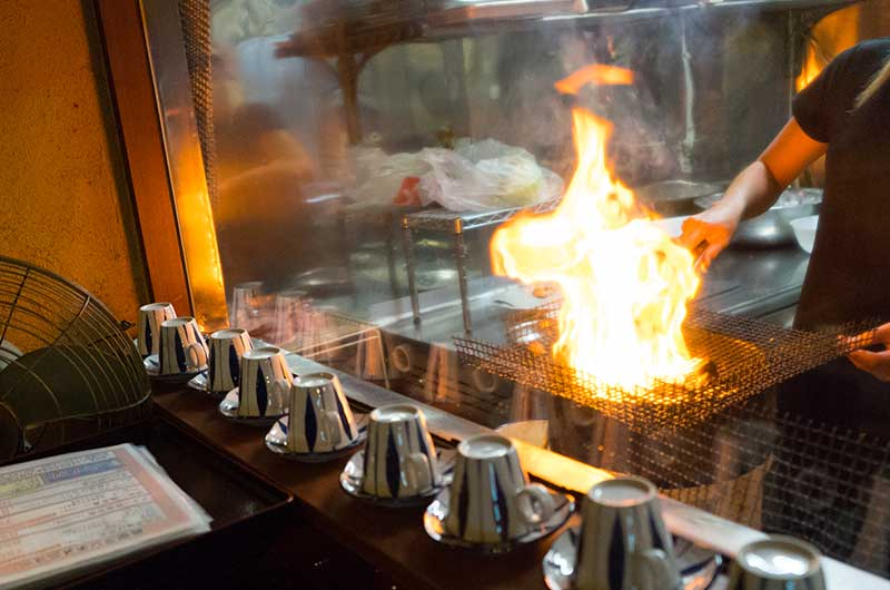 Thigh cubes barbecued at kitchen in restaurant Shirogane Tritei 