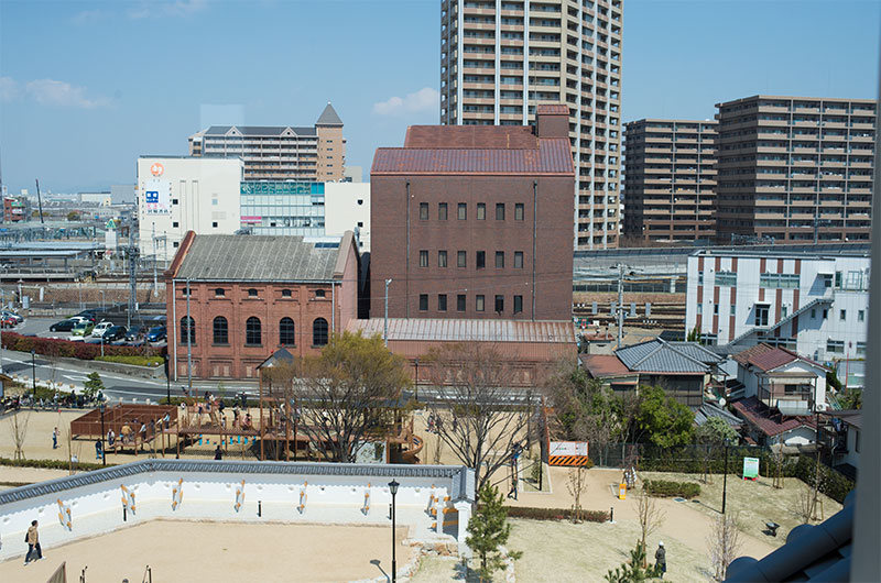 Old block warehouse and Amagasaki station in Hanshin line viewed from observation area