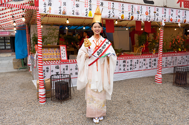 Shrine maiden in festival of God Ebisu at Hattori Shrine