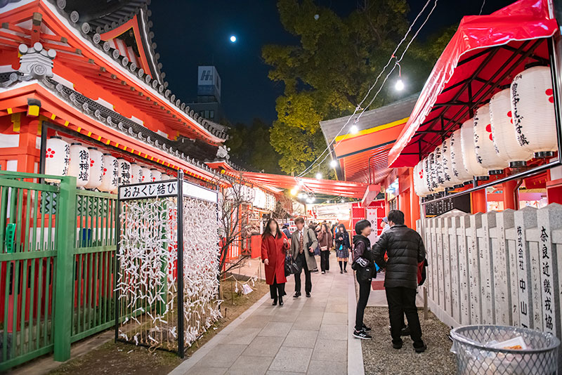 Full moon and main gate in festival of God Ebisu Toyonaka at Hattori Shrine