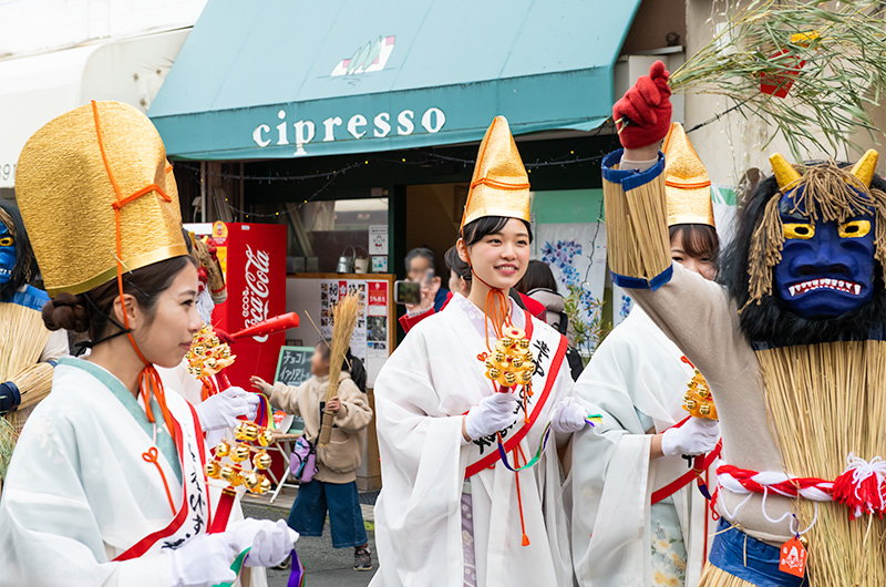 Shrine Maidens and demons patrolling in front of Hattori-tenjin station of Hankyu line at Setsubun festival of Hattori Shrine in second year of Reiwa
